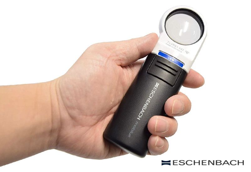 Eschenbach Mobilux LED Handheld Magnifier with Mobase Stand - 5X or 6X  Magnification - Hands Free Magnifier with Light and Stand - Low Vision  Magnifier Aid with Liberty Microfiber Cloth
